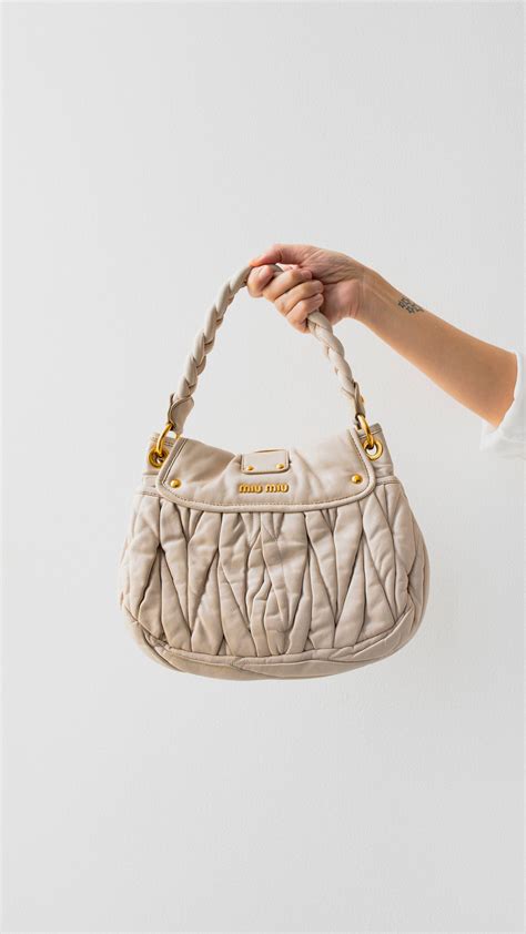 miu miu cream bag|miumiu clutch bag.